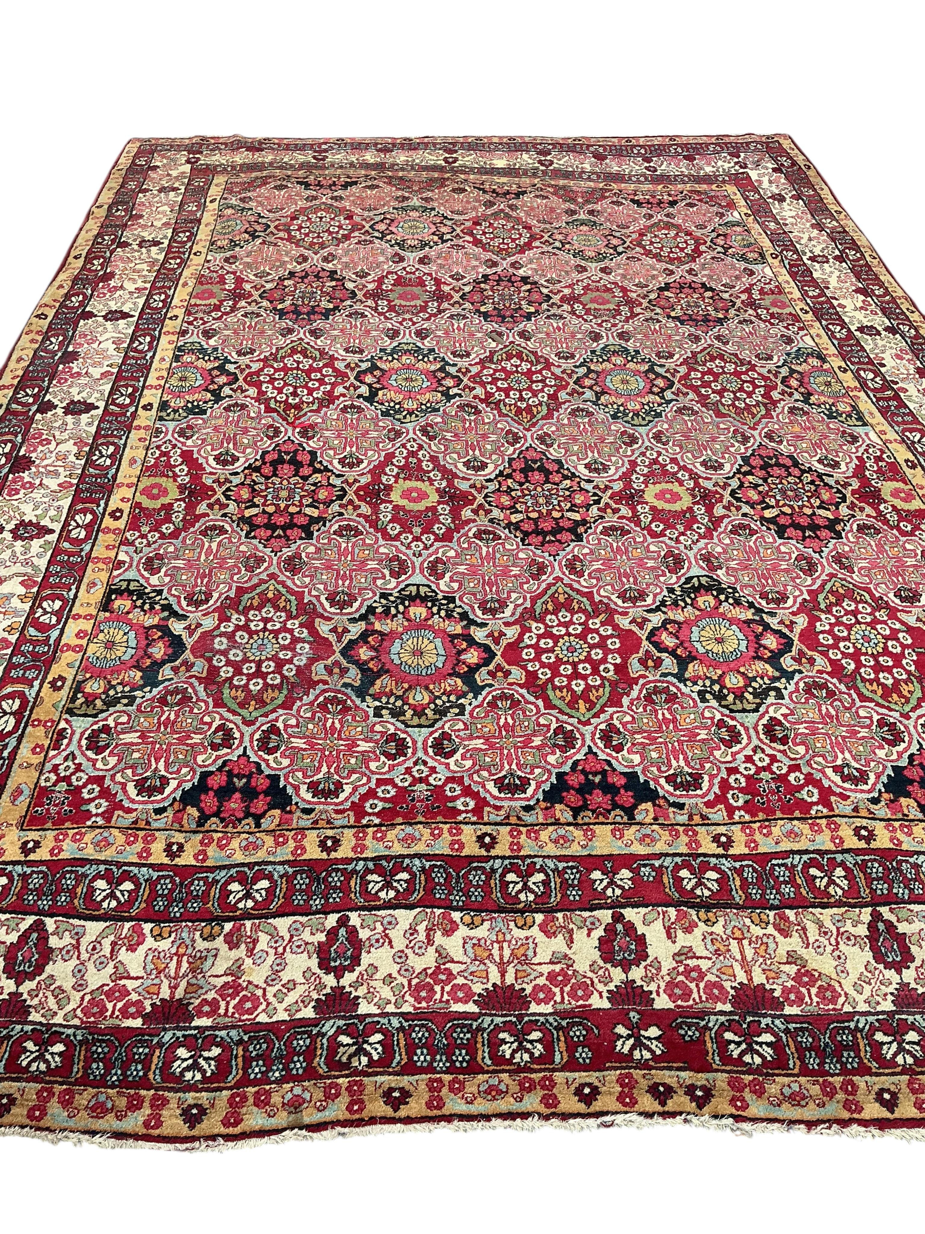 An Agra multi coloured carpet, the ground woven with interlocking oval medallions, 455 x 315cm